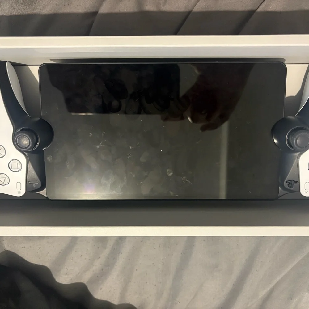 Sony Portable Handheld Gaming Controller - White and Black